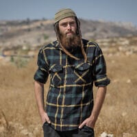 Elisha Yered at the illegal West Bank settlement outpost of Ramat Migron, on September 8, 2023. (Chaim Goldberg/Flash90)