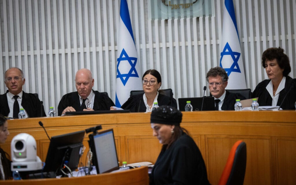 Supreme Court President Esther Hayut and other justices at a High Court hearing on the 'reasonableness law,' at the Supreme Court in Jerusalem, September 12, 2023. Judge Noam Sohlberg is at left and Judge Isaac Amit. (Yonatan Sindel/Flash90) Supreme Court President Esther Hayut and other justices at a High Court hearing on the 'reasonableness law,' at the Supreme Court in Jerusalem, September 12, 2023. Judge Noam Sohlberg is at left and Judge Isaac Amit. (Yonatan Sindel/Flash90)