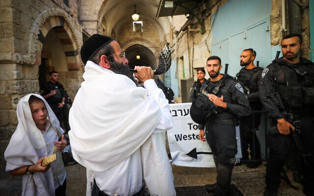 An ultra-Orthodox Jewish man blows a shofar at an entrance to the Temple Mount compound in Jerusalem's Old City, on September 17, 2023, during the Jewish holiday of Rosh Hashanah. (Jamal Awad/Flash90)