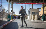 Police and security personnel at Mazmuria checkpoint, near East Jerusalem, where a Palestinian man attempted to stab police officers, September 18, 2023. (Yonatan Sindel/Flash90)