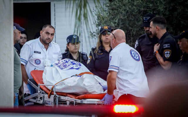 Authorities transport the body of one of the people killed in a mass shooting in the northern Bedouin town of Basmat Tab’un on September 27, 2023. (Shir Torem/FLASH90)