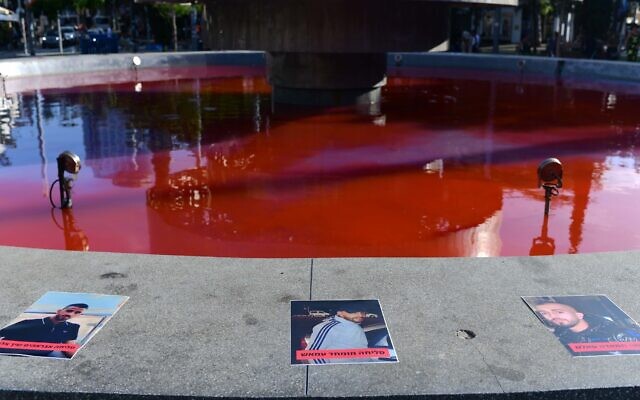 The water at the fountatin in Tel Aviv's Dizengoff Square is dyed red to protest the government's response to deadly violent crime in Arab Israelis communities, September 28, 2023. (Tomer Neuberg/Flash90)