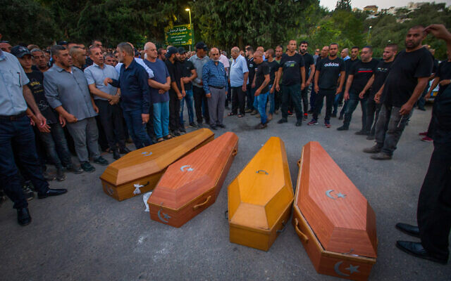 Mourners attend the funeral for five members of the same family who were shot to death in the northern Bedouin town of Basmat Tab’un, September 29, 2023. (Flash90) Mourners attend the funeral for five members of the same family who were shot to death in the northern Bedouin town of Basmat Tab’un, September 29, 2023. (Flash90)