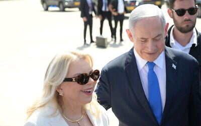 Sara Netanyahu and Prime Minister Benjamin Netanyahu speak to the press from the tarmac at Ben Gurion International Airport on September 3, 2023 ahead of their state visit to Cyprus. (Amos Ben Gershom/ GPO)