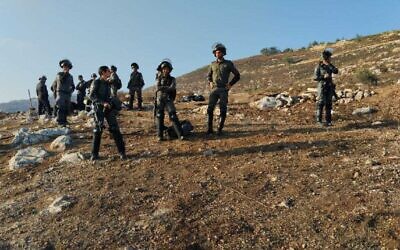 Illustration: Police and Civil Administration official take apart illegal constructions near the West Bank settlement of Yitzhar, September 4, 2023. (Courtesy/ File)