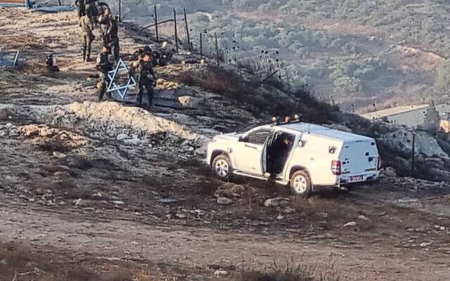Police and Civil Administration official take apart an illegally construction memorial and lookout point near the West Bank settlement of Yitzhar, September 4, 2023. (Courtesy)