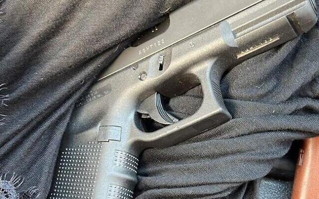A pistol retrieved from the scene where a man was suspected of shooting his wife dead and then attempting to take his own life, causing himself moderate injuries in Rahat, September 11, 2023. (Israel Police) A pistol retrieved from the scene where a man was suspected of shooting his wife dead and then attempting to take his own life, causing himself moderate injuries in Rahat, September 11, 2023. (Israel Police)