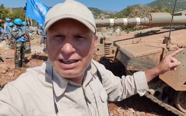 Ali Shoeib, a journalist with the Hezbollah-affiliated Lebanese Al-Manar station, films himself next to an IDF tank on the Israeli border on September 26, 2023 (Screen capture/X)