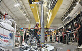 This handout photograph released by CERN shows the insertion of the ALPHA-g apparatus at CERN in Geneva on October 15, 2018. (Handout/CERN/AFP)