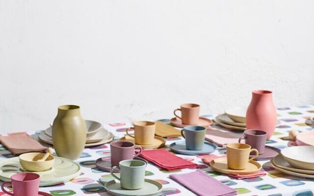Stylist Nurit Kariv sets this table with pieces from Nu, her home brand collection that includes a tablecloth designed with her own watercolors (Courtesy Nu) Stylist Nurit Kariv sets this table with pieces from Nu, her home brand collection that includes a tablecloth designed with her own watercolors (Courtesy Nu)