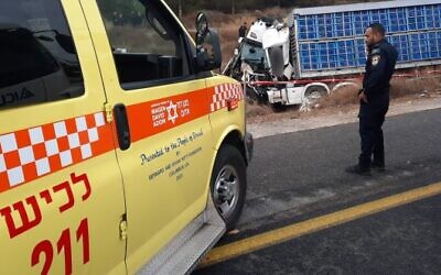Police and medics at the scene of a deadly accident involving four trucks near the southern city of Kiryat Gat on September 13, 2023 (Magen David Adom)