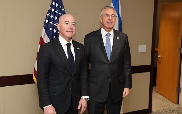 In this handout photo, Israeli Ambassador Michael Herzog (R) and US Homeland Security Alejandro Mayorkas attend a ceremony in Washington to mark Israel's entry to the US Visa Waiver Program, September 28, 2023. (Michael Keres/Israeli Embassy in Washington)