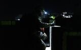 Israeli troops measure the home of a Palestinian charged with aiding Hamas terrorists in carrying out a deadly shooting attack, in the West Bank village of Urif, September 19, 2023. (Israel Defense Forces)