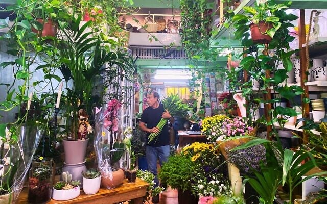 Shlomo Marmor at the flower shop on Yehuda Halevi Street in Tel Aviv that his family has owned for 70 years. September 2023. (Shoshanna Solomon / The Times of Israel)