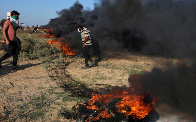 Palestinian protesters burn tires during clashes with Israeli security forces along the frontier with Israel, east of Gaza City, September 22, 2023. (AP Photo/Adel Hana) Palestinian protesters burn tires during clashes with Israeli security forces along the frontier with Israel, east of Gaza City, September 22, 2023. (AP Photo/Adel Hana)