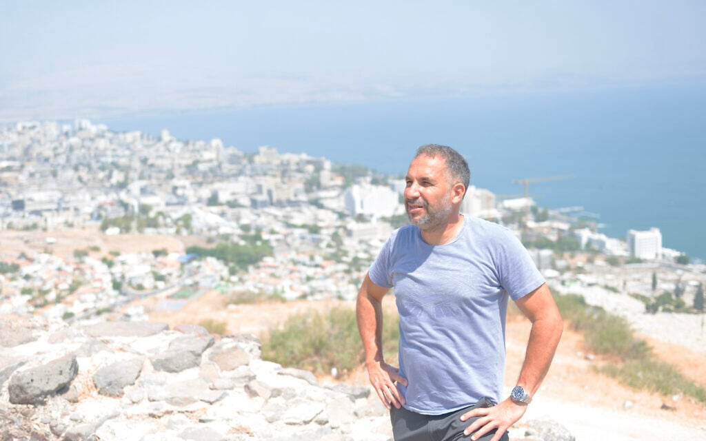 Ron Cobi, a former mayor of Tiberias and a candidate for the job, stands atop a hill overlooking his city in Israel on August 22, 2023. (Canaan Lidor/Times of Israel) Ron Cobi, a former mayor of Tiberias and a candidate for the job, stands atop a hill overlooking his city in Israel on August 22, 2023. (Canaan Lidor/Times of Israel)