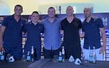 Former Barcelona stars Rivaldo and Javier Saviola pose for photo with Maccabi Tel Aviv's Avi Nimni and Tal Ben-Haim, ahead of a friendly match in Tel Aviv, September 4, 2023. (Charlie Summers)