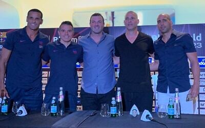 Former Barcelona stars Rivaldo and Javier Saviola pose for photo with Maccabi Tel Aviv's Avi Nimni and Tal Ben-Haim, ahead of a friendly match in Tel Aviv, September 4, 2023. (Charlie Summers)