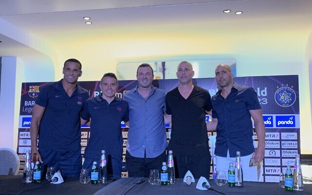 Former Barcelona stars Rivaldo and Javier Saviola pose for photo with Maccabi Tel Aviv's Avi Nimni and Tal Ben-Haim, ahead of a friendly match in Tel Aviv, September 4, 2023. (Charlie Summers)