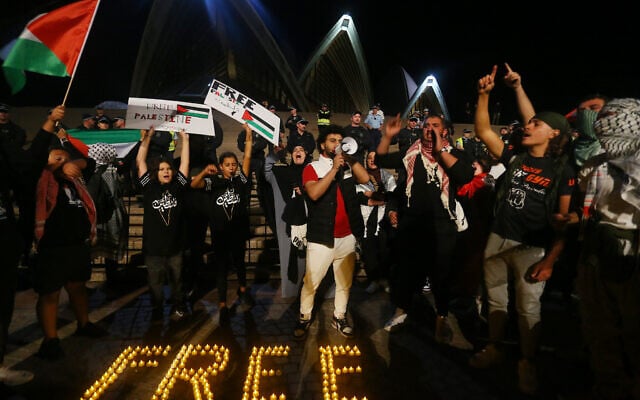 Anti-Israel protesters rally outside the Sydney Opera House, October 9, 2023. (Lisa Maree Williams/Getty Images via JTA)