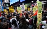 US pro-Palestinian activists during a protest in support of the terror attack against Israel, in New York City, October 8, 2023. (Luke Tress/Times of Israel)