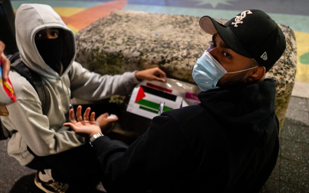 Pro-Palestinian activists put up posters near New York City’s Union Square subway station, October 16, 2023. (Luke Tress/ JTA)