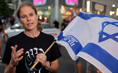 Protest leader Shikma Bressler speaks to reporters during a protest against the judicial overhaul in Tel Aviv on July 18, 2023. (Jack Gueez/AFP)