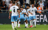 Israel's players celebrate after winning the UEFA Euro 2024 group I qualification football match Israel v Belarus at the Bloomfield stadium in Tel Aviv on September 12, 2023. (Jack Guez/AFP)