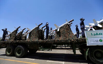 Houthi soldiers stand guard on a missile carrier during a military parade on September 21, 2023. (MOHAMMED HUWAIS / AFP)