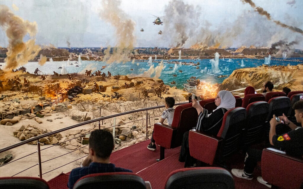 People attend a presentation of a recreated war scene while visiting the "6th of October War Panorama" museum and memorial of the 1973 Arab-Israeli War in Cairo, Egypt, on October 1, 2023. (Khaled DESOUKI/AFP) People attend a presentation of a recreated war scene while visiting the "6th of October War Panorama" museum and memorial of the 1973 Arab-Israeli War in Cairo, Egypt, on October 1, 2023. (Khaled DESOUKI/AFP)