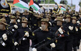 Palestinian terrorists of the Islamic Jihad movement participate in an anti-Israel military parade marking the 36th anniversary of the movement's foundation in Gaza City, October 4, 2023. (Mahmud Hams/AFP)