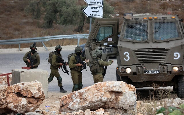Israeli soldiers patrol near the West Bank city of Tulkarm after clashes between Palestinian gunmen and Israeli forces on October 5, 2023. (Photo by Zain JAAFAR / AFP) Israeli soldiers patrol near the West Bank city of Tulkarm after clashes between Palestinian gunmen and Israeli forces on October 5, 2023. (Photo by Zain JAAFAR / AFP)