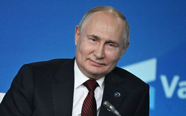 This pool photograph distributed by Russian state owned agency Sputnik shows Russian President Vladimir Putin attending the plenary session of the Valdai Discussion Club forum in Sochi on October 5, 2023. (Sergei GUNEYEV / POOL / AFP)