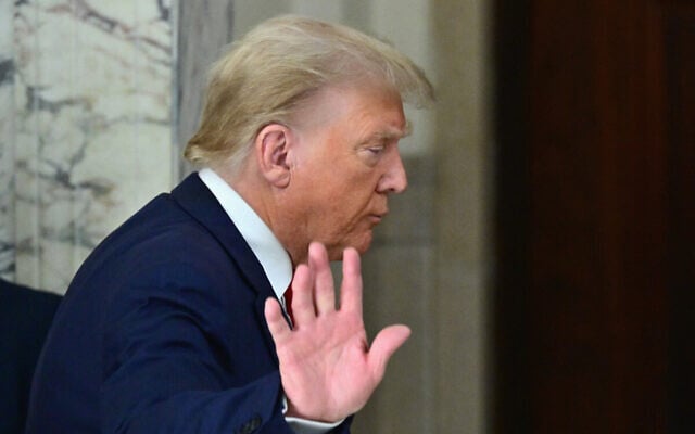Former US President Donald Trump waves after speaking to the media during the third day of his civil fraud trial in New York on October 4, 2023. (ANGELA WEISS / AFP) Former US President Donald Trump waves after speaking to the media during the third day of his civil fraud trial in New York on October 4, 2023. (ANGELA WEISS / AFP)