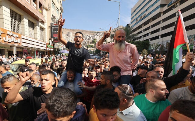 Palestinians in the West Bank city of Nablus celebrate on October 7, 2023, after Hamas terrorists infiltrated Israel from the Gaza Strip and launched a brutal large-scale attack on Israeli towns and cities. (Photo by Jaafar ASHTIYEH / AFP) Palestinians in the West Bank city of Nablus celebrate on October 7, 2023, after Hamas terrorists infiltrated Israel from the Gaza Strip and launched a brutal large-scale attack on Israeli towns and cities. (Photo by Jaafar ASHTIYEH / AFP)