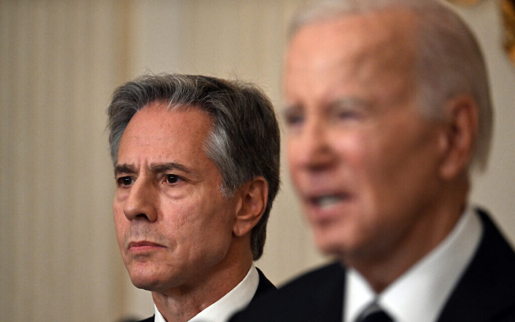 US Secretary of State Antony Blinken, left, listens as US President Joe Biden addresses the Hamas terrorist attack on Israel, from the State Dining Room of the White House in Washington, DC, on October 7, 2023. (Photo by Jim WATSON / AFP) US Secretary of State Antony Blinken, left, listens as US President Joe Biden addresses the Hamas terrorist attack on Israel, from the State Dining Room of the White House in Washington, DC, on October 7, 2023. (Photo by Jim WATSON / AFP)