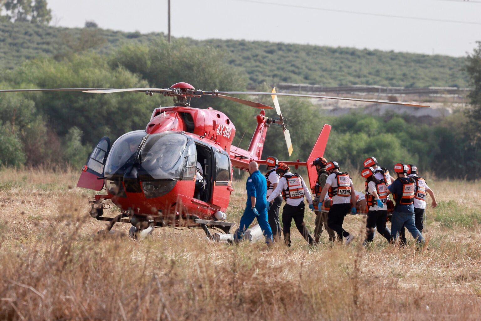 Israeli rescue teams evacuate a wounded person by helicopter near the southern city of Sderot on October 7, 2023 (Menahem KAHANA / AFP)