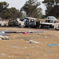 Burnt cars are left behind at the site of the massacre three days earlier by Palestinian terrorists on the Supernova desert music festival near Kibbutz Re'im in the Negev desert in southern Israel, on October 10, 2023. (Jack Guez/AFP)