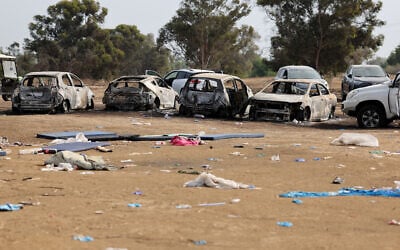 Burnt cars are left behind at the site of the attack three days earlier by Palestinian terrorists on the Supernova desert music near Kibbutz Re'im in the Negev desert in southern Israel, on October 10, 2023. (Jack Guez/AFP)