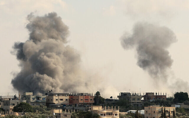 Smoke billows from the Gaza's Rafah border crossing with Egypt during an Israeli airstrike on October 10, 2023. (Photo by SAID KHATIB / AFP)