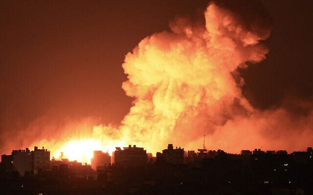 Explosions illuminate the sky during Israeli strikes on Gaza City on October 10, 2023. (MAHMUD HAMS / AFP) Explosions illuminate the sky during Israeli strikes on Gaza City on October 10, 2023. (MAHMUD HAMS / AFP)