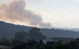 Smoke billows after an apparent Israeli strike on the village of Alma al-Shaab on October 13, 2023 (Christina ASSI / AFP)