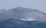 A picture taken from Lebanese town of Marjayoun shows smoke billowing in the contested border area of Mount Dov on October 14, 2023. (Joseph EID / AFP)