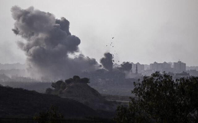 A picture taken from Sderot shows smoke plumes rising above buildings during an Israeli strike on the northern Gaza Strip on October 14, 2023. (Aris Messinis/AFP) A picture taken from Sderot shows smoke plumes rising above buildings during an Israeli strike on the northern Gaza Strip on October 14, 2023. (Aris Messinis/AFP)