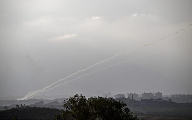 A picture taken from Sderot shows rockets being fired towards Israel from the northern Gaza Strip on October 14, 2023. (Aris Messinis/AFP) A picture taken from Sderot shows rockets being fired towards Israel from the northern Gaza Strip on October 14, 2023. (Aris Messinis/AFP)