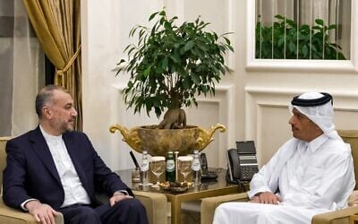 Qatar's Prime Minister and Foreign Minister Mohammed bin Abdulrahman al-Thani (R) meeting with Iran's Foreign Minister Hossein Amir-Abdollahian in Doha on October 14, 2023. (Qatar News Agency / AFP)