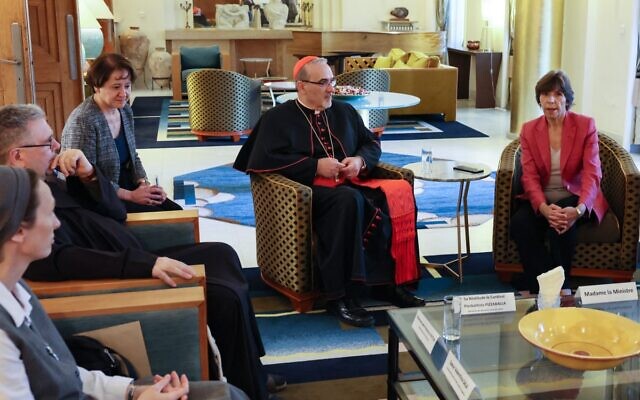 Latin Patriarch of Jerusalem Pierbattista Pizzaballa (center) and other religious figures meet with French Foreign Minister Catherine Colonna (right) at the French consulate in Jerusalem, October 15, 2023. (ALAIN JOCARD / AFP) Latin Patriarch of Jerusalem Pierbattista Pizzaballa (center) and other religious figures meet with French Foreign Minister Catherine Colonna (right) at the French consulate in Jerusalem, October 15, 2023. (ALAIN JOCARD / AFP)