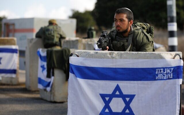 Israeli soldiers man a checkpoint near the northern border with Lebanon on October 17, 2023. (Jalaa Marey/AFP) Israeli soldiers man a checkpoint near the northern border with Lebanon on October 17, 2023. (Jalaa Marey/AFP)
