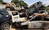 A picture taken on October 17, 2023 shows a pile of damaged and burnt vehicles in the southern city of Sderot, following the October 7 attack by Hamas. (Jack Guez/AFP)
