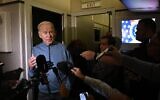 US President Joe Biden speaks to members of the media during his flight returning from Israel aboard Air Force One, on October 18, 2023. (Brendan Smialowski/AFP)